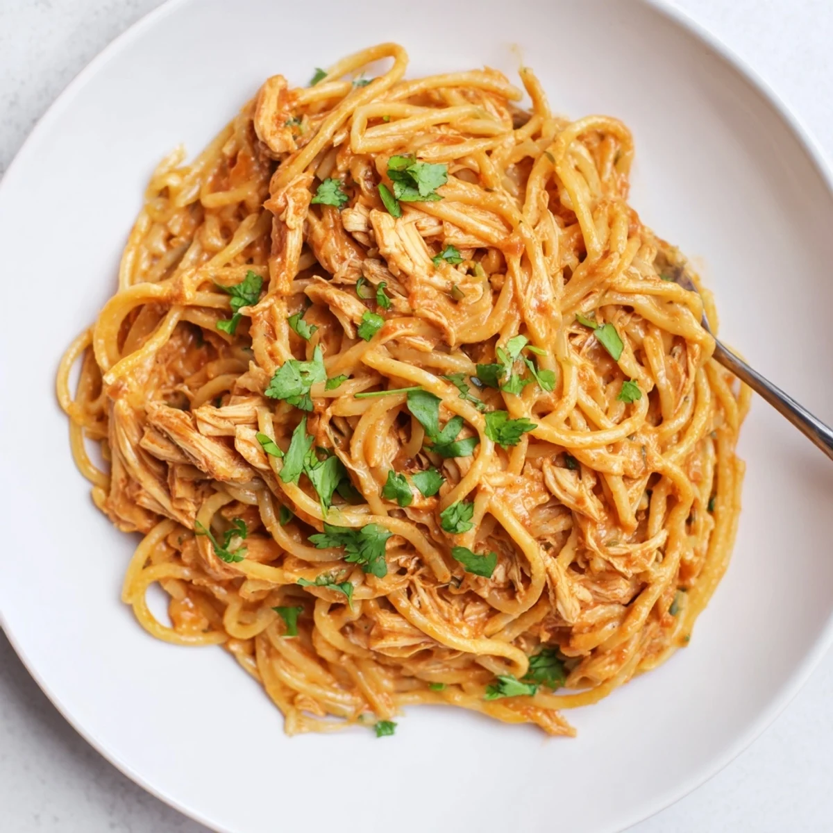 Delicious Creamy Chipotle Chicken Spaghetti coated in a smoky cheese sauce.  