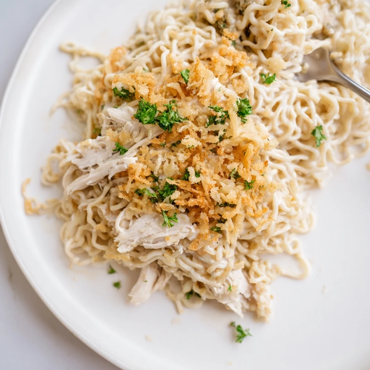 Savory Garlic Parmesan Chicken Ramen Bake topped with crispy panko breadcrumbs.  