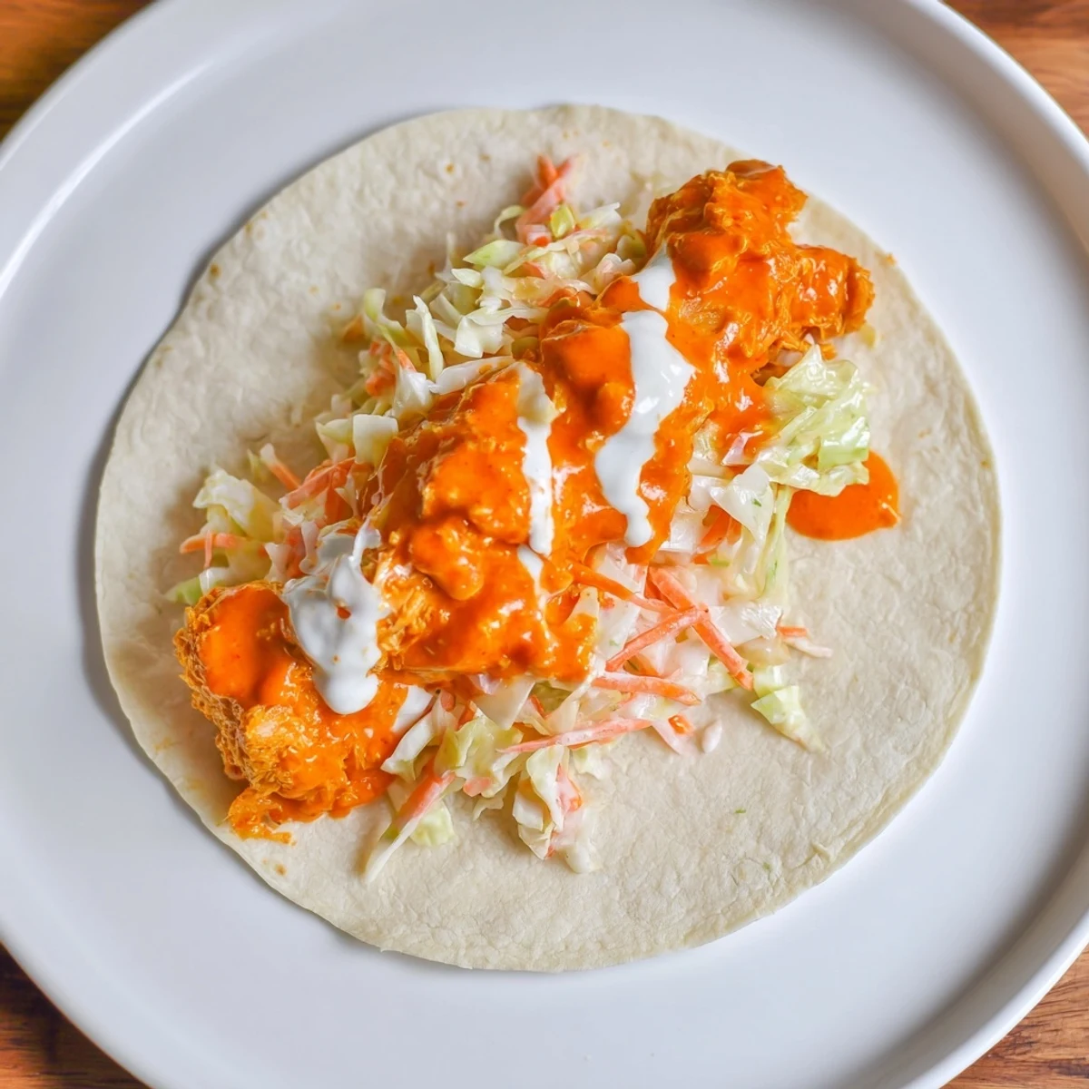 Golden-brown Buffalo Chicken Smash Burger Tacos filled with creamy ranch slaw—a delicious, easy meal.