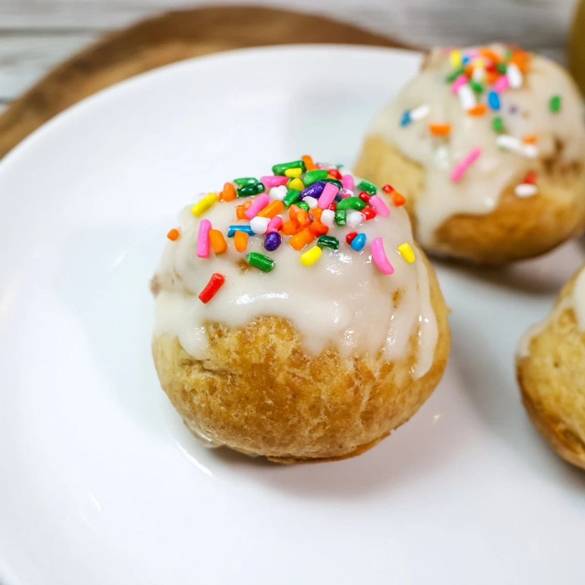 Quick Christmas Biscuit Bombs displayed with a sweet glaze, warm and ready for a festive dessert.