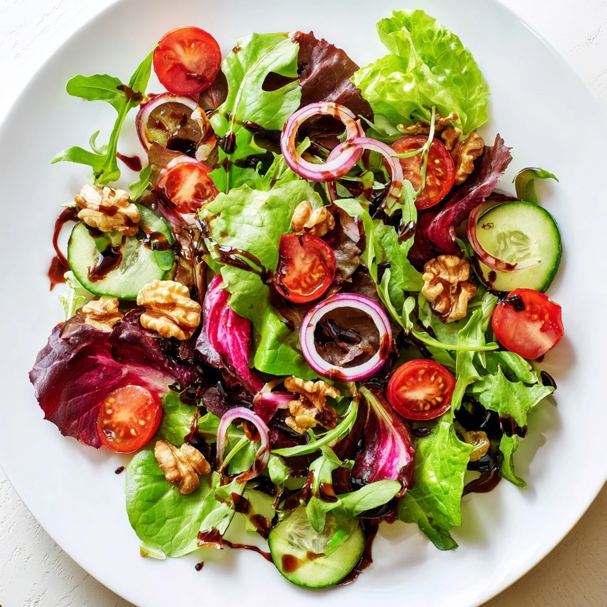 Vibrant Quick Balsamic Vinegar Salad with juicy tomatoes, drizzled with a balsamic reduction over fresh greens.