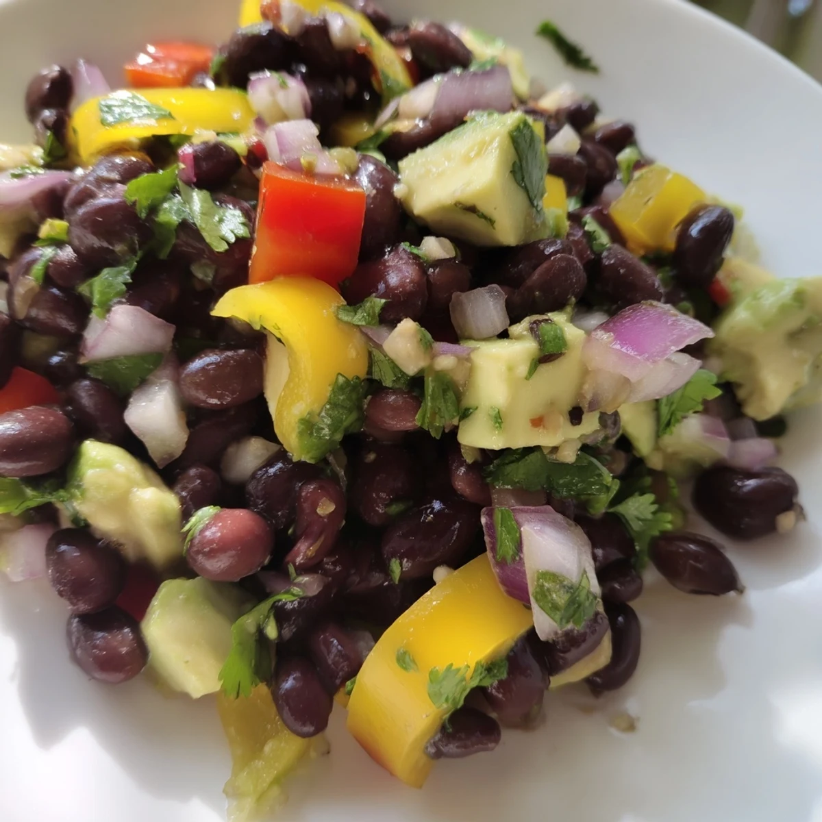 Vibrant Southwest Black Bean Salad, a colorful mix of corn and peppers coated in tangy dressing.