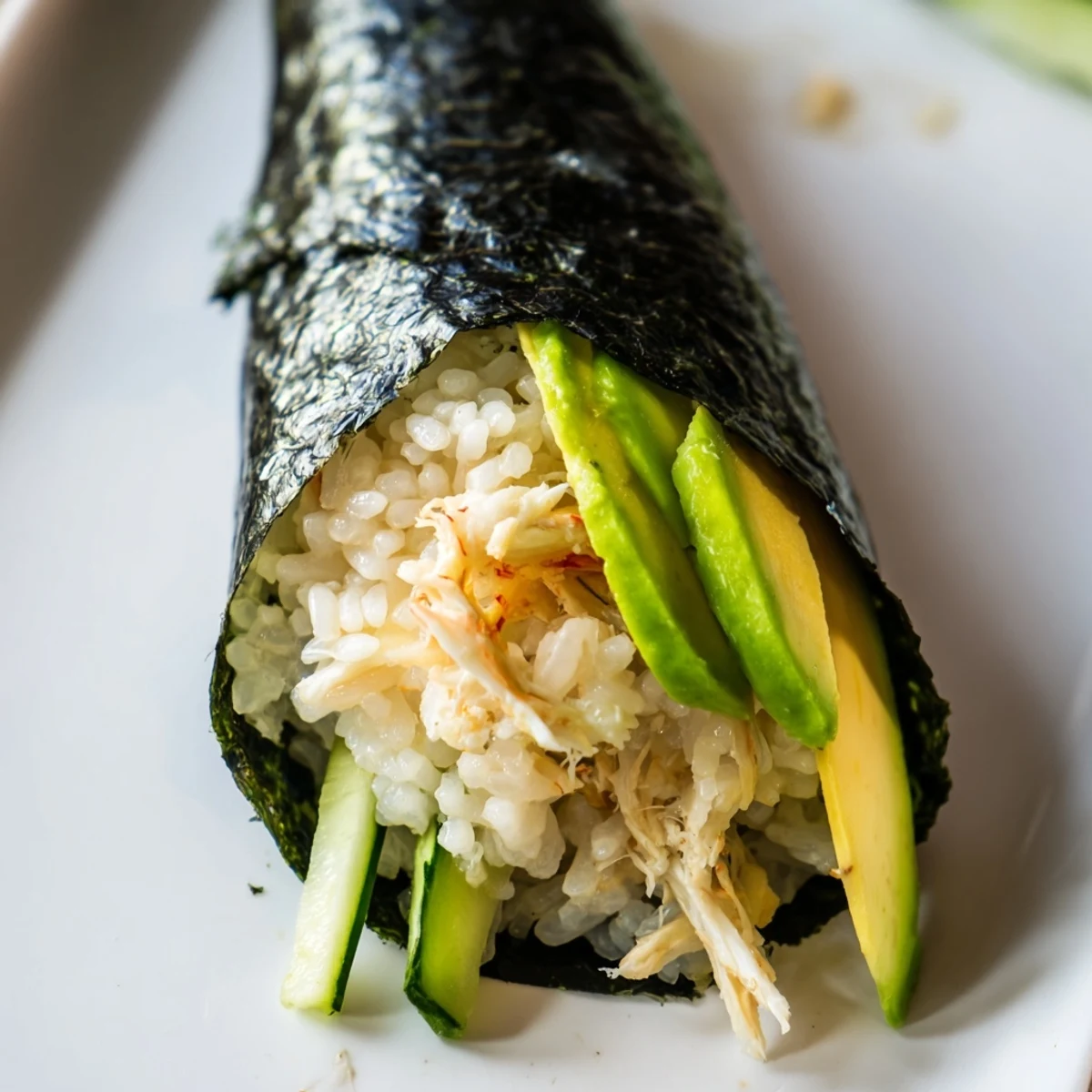 Homemade Sushi Rice Hand Rolls featuring fluffy rice, crab, and fresh veggies, ready for dipping in soy sauce.