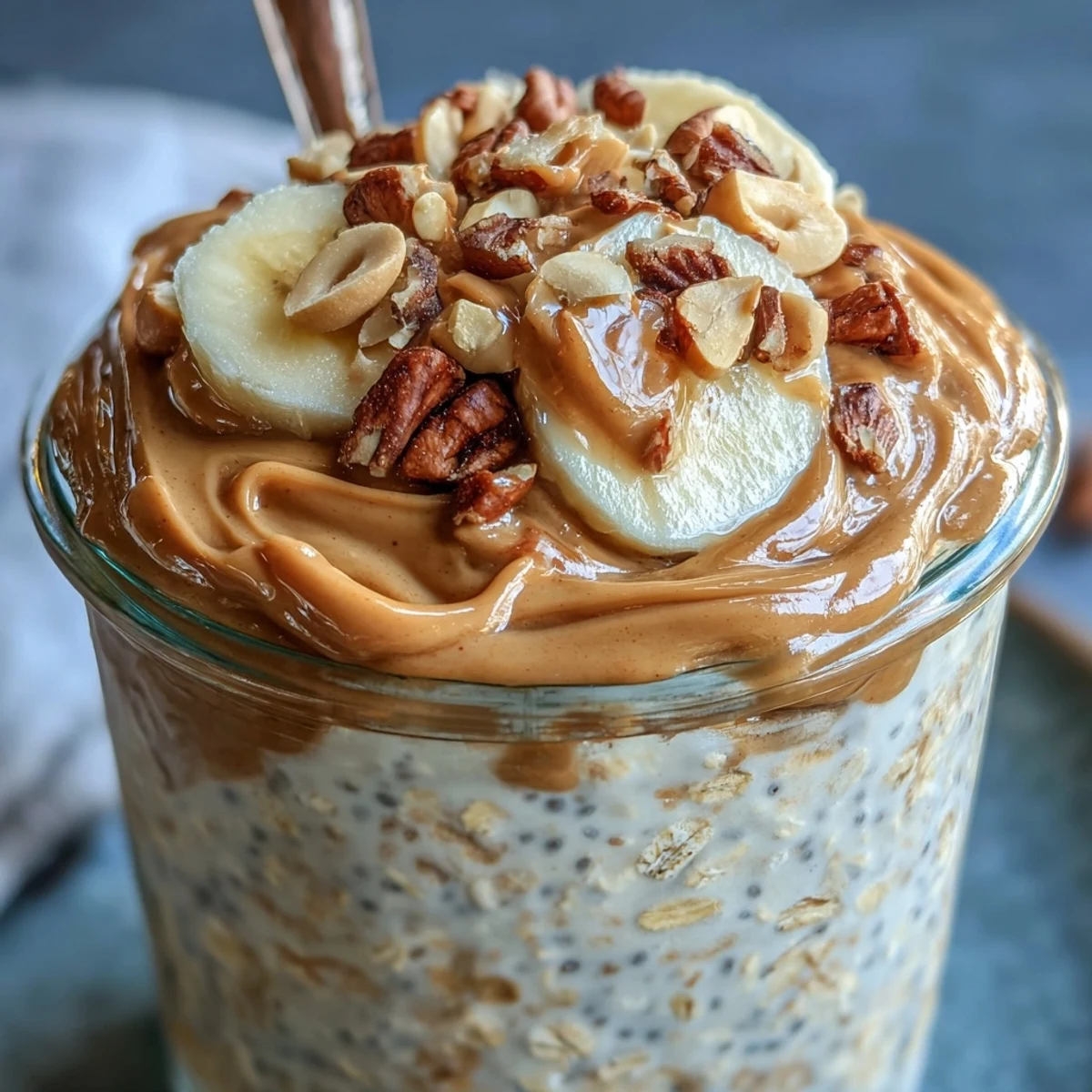 Rolled oats soak in creamy peanut butter, protein powder, and milk overnight for a thick, satisfying breakfast.