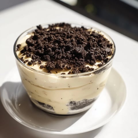 A layered Vanilla Pudding with Crushed Oreos, a homemade dessert filled with creamy goodness.