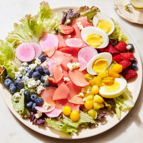 Baby Shower Pastel Palette Salad brimming with colorful fresh fruits and greens, ready to eat!
