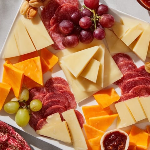 Geometric Gala charcuterie board, a stunning arrangement of triangle and rhombus cheeses and meats.