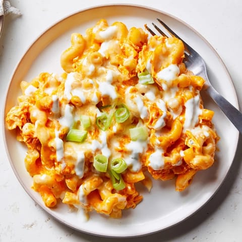 Hearty Buffalo Chicken Pasta bake, perfect for weeknight dinners, served with ranch.  