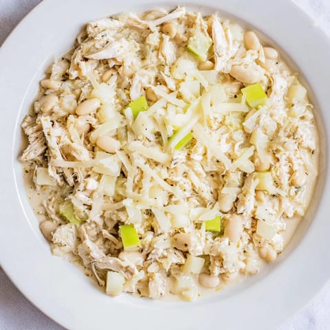 A close-up view of a bowl of the savory 35-Minute White Cheddar Apple Chicken Chili.