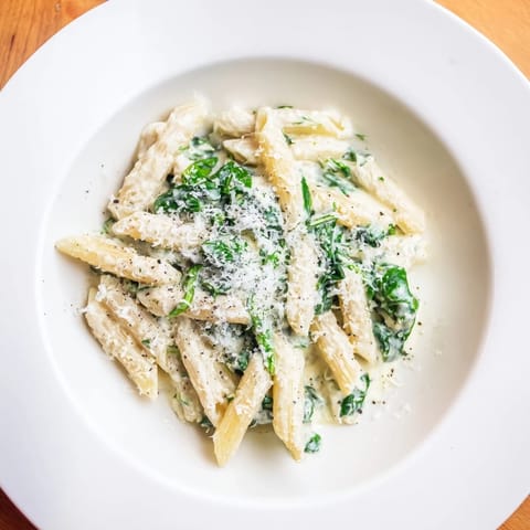 This delicious Cottage Cheese Creamy Spinach Pasta is perfectly coated with fresh, flavorful sauce, ready to eat.