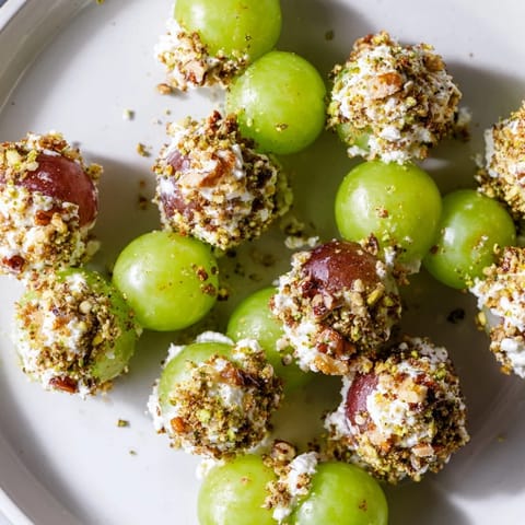 Close-up of a festive Sparkling Grape Cluster, a delicious appetizer with vivid red and green grapes.