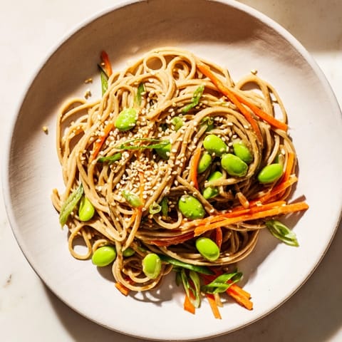 Close-up of Asian Sesame Noodle Salad, showcasing a medley of colorful, fresh ingredients and rich flavors.