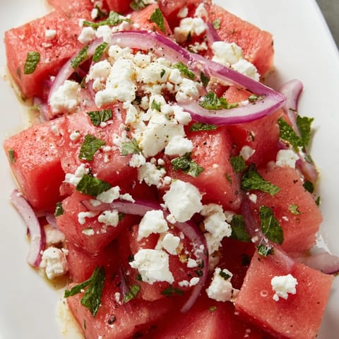 Fresh Watermelon Feta Salad, a refreshing Mediterranean-inspired dish with a tangy lime dressing.