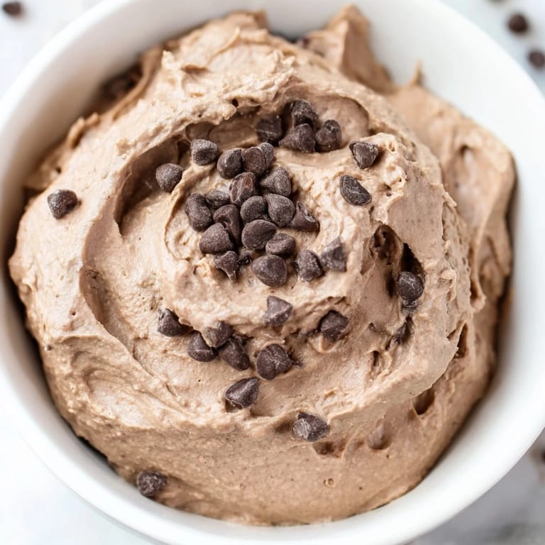 Beautifully textured gluten-free Brownie Batter Dip, ready to be enjoyed with pretzels and friends.
