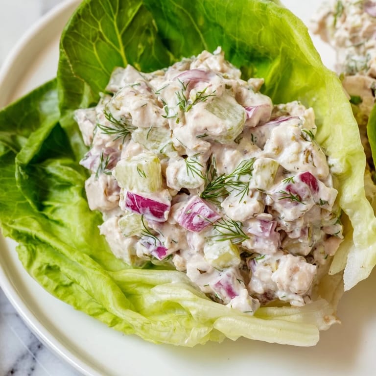 Bright, creamy dill pickle chicken salad spooned into tender lettuce cups, perfect for easy meal prep or parties.