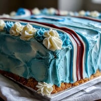 Festive graduation cake shaped like a sports jersey with bold team colors and personalized number, perfect for celebrating athletic achievements.